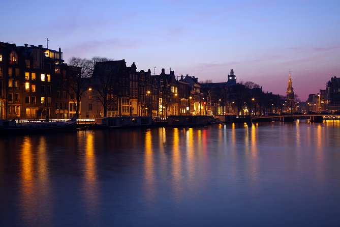1-Hour Amsterdam Evening Canal Cruise - The covered boat and taking photographs