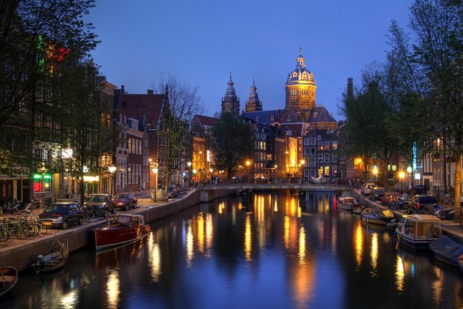 1-Hour Amsterdam Evening Canal Cruise - Leaving the waterfront as Amsterdam lights up