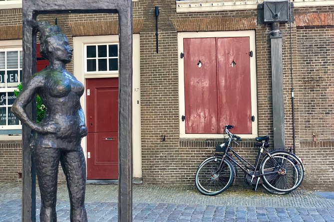 Absolutely Amsterdam - the Essential Introductory Walking Tour - Damrak and the Red Light District: religion, law, and hard choices