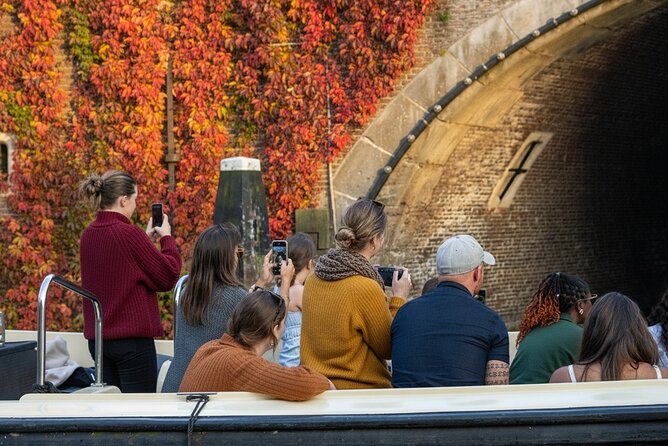 Amsterdam 1-Hour Canal Cruise With Live Guide - Jordaan churches, markets, and places of memory