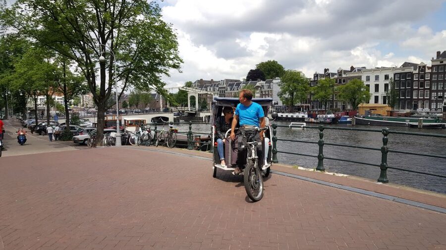 Amsterdam 1-Hour Rickshaw Tour - Passing the Red Light District and coffee shops