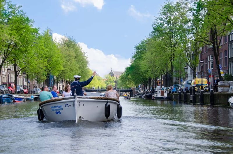 Amsterdam: 75 minute Open Boat Canal Cruise with Live Guide - Starting opposite the Hard Rock Cafe