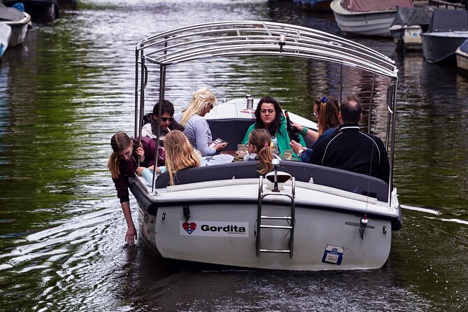 Amsterdam 90-min Private Canal Cruise with Live Guide and Drinks - Drinks, comfort, and the weather question