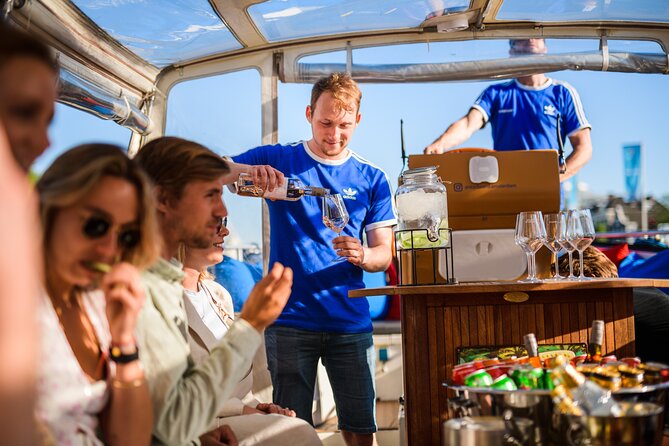 Amsterdam: Canal Booze Cruise with Unlimited Drinks Option - Seeing the Red Light District from the Water