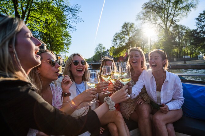 Amsterdam: Canal Booze Cruise with Unlimited Drinks Option - Drinks, Food, and the Social Mood