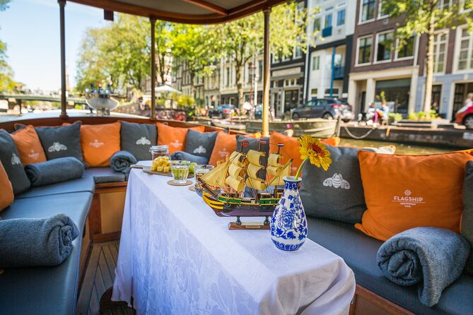 Amsterdam Canal Cruise in Classic Salon Boat With Drinks and Cheese - A canal hour with a glass in hand