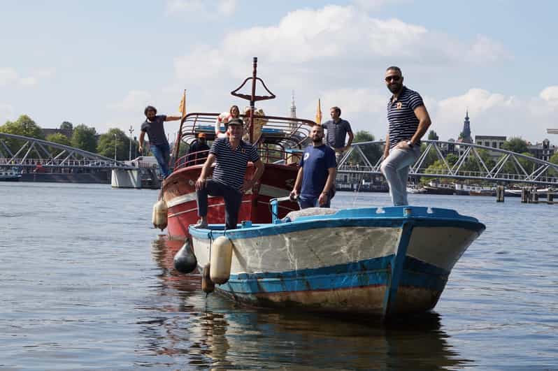 Amsterdam: Canal Cruise on a Wooden Refugee Boat - A wooden boat with a difficult past