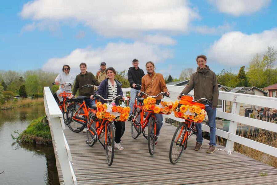 Amsterdam: Cheese, Windmill & Countryside Bike Tour - Starting near Central Station and crossing the water