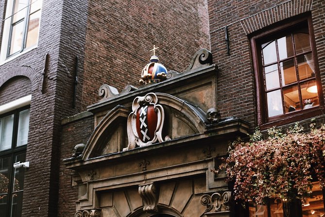 Amsterdam City Center Guided Walking Tour Semi-Private 12ppl Max - Following Zeedijk from sea dike to Chinatown