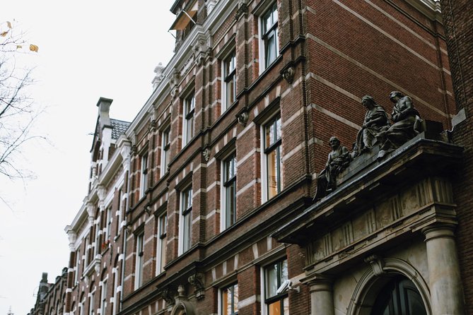 Amsterdam City Center & History - Exclusive Guided Walking Tour - Medieval towers, sea defenses, and Nieuwmarkt