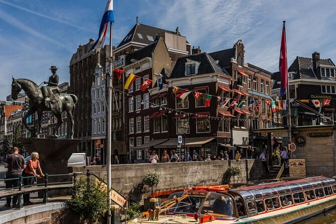 Amsterdam City Highlights and Hidden Gems - Private & Custom Tour - A central square with cafés, books, and side streets