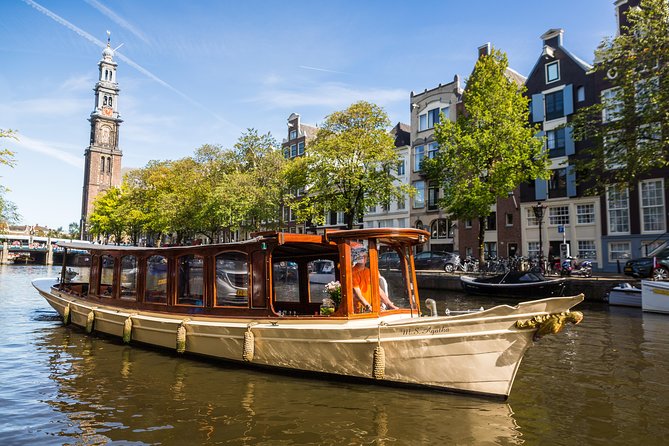 A saloon boat on an Amsterdam canal below the Westerkerk