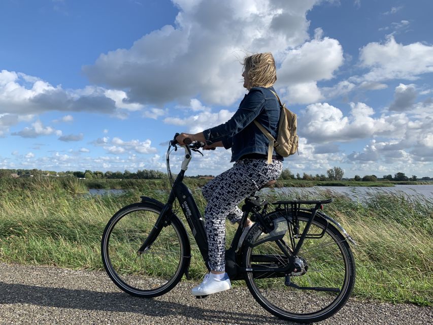 Amsterdam: Countryside Bike Tour and Zaanse Schans Windmills - Clogs, Gouda, and the practical side of Dutch tradition