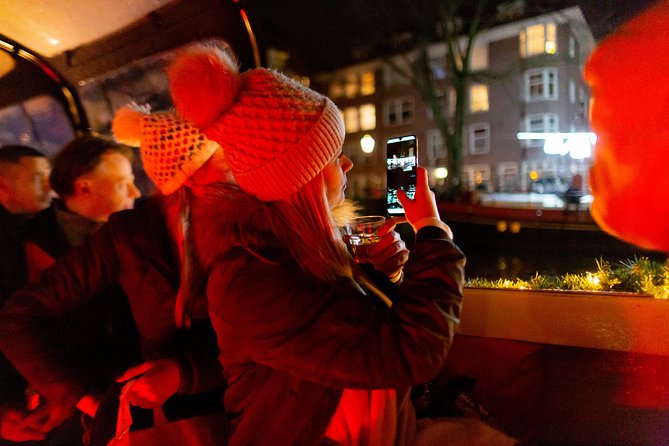 Amsterdam Evening Canal Cruise with Live Guide and Onboard Bar - The UNESCO canal ring and its famous bridges