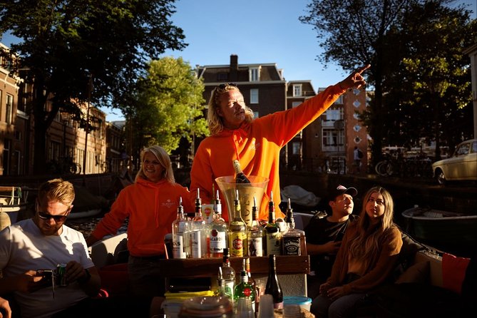 Amsterdam Evening Canal Cruise with Live Guide and Onboard Bar - Drinks, cheese, and the onboard atmosphere