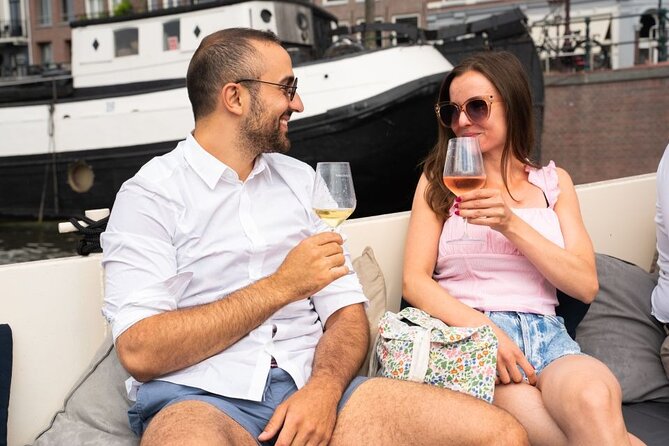 Amsterdam: Evening Candle Light Cruise With Wine & Cheese - Damrak’s Dancing Houses and the Grand Canals
