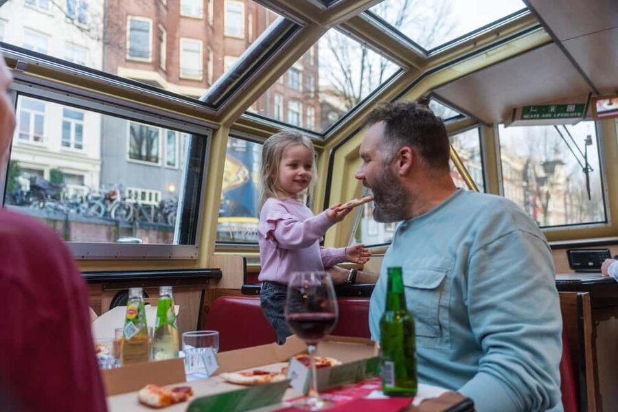 Amsterdam: Evening Pizza Cruise Along the Canals - Commentary, music, and the pace on board