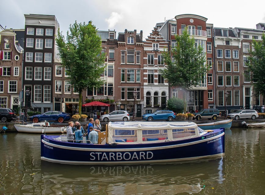 Amsterdam: German Guided Canal Cruise with on Board Bar - Montelbaanstoren, Rembrandt’s neighborhood, and Herengracht