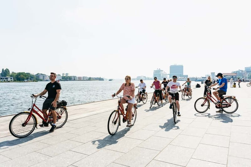 Amsterdam: Guided Bike Tour City Centre in EN/DE/FR/ES - Bikes, helmets, languages, and group size