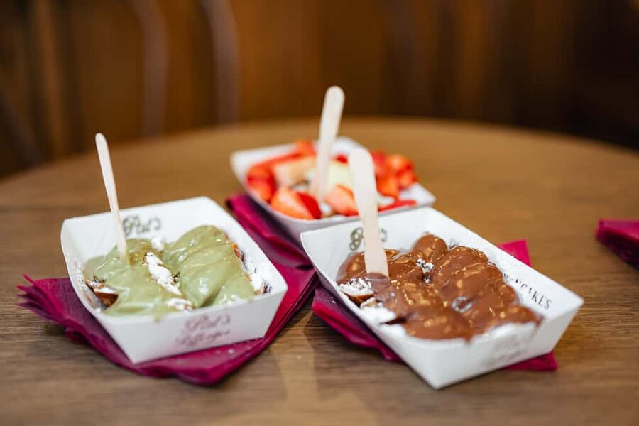 Amsterdam: Guided Cultural Food Tour in German or English - The canal belt and Amsterdam’s crooked houses