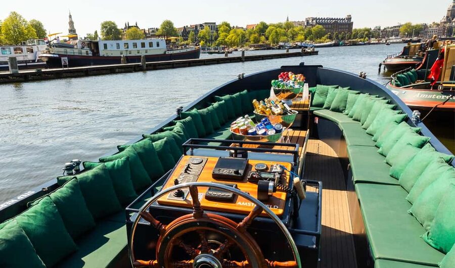 Amsterdam: Guided Open Boat Canal Cruise Including Drink - Jewish Amsterdam, Waterlooplein, and the Amstel