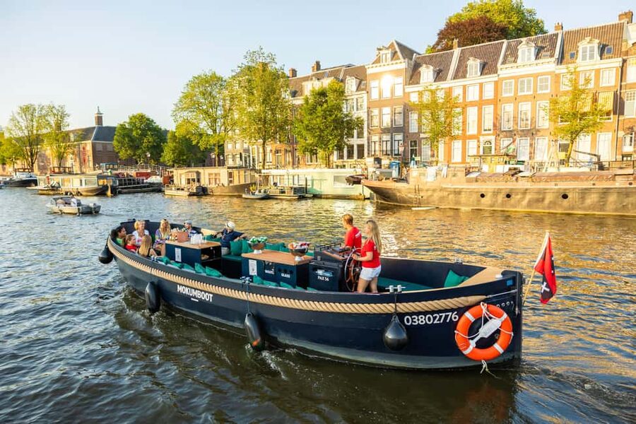 Amsterdam: Guided Open Boat Canal Cruise Including Drink - One included drink or unlimited drinks