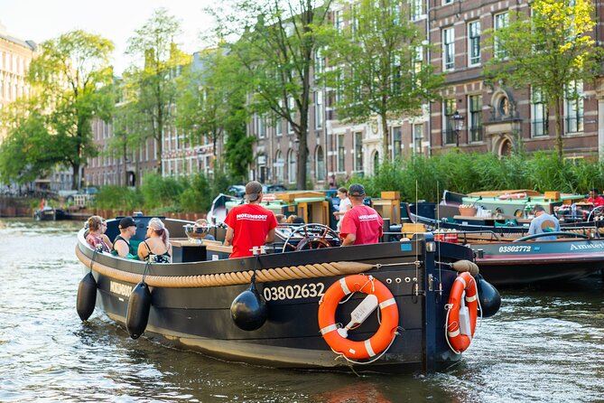 Amsterdam: Guided Open Boat Canal Cruise Unlimited Drinks Option - The Jordaan, houseboats, and Anne Frank’s neighborhood