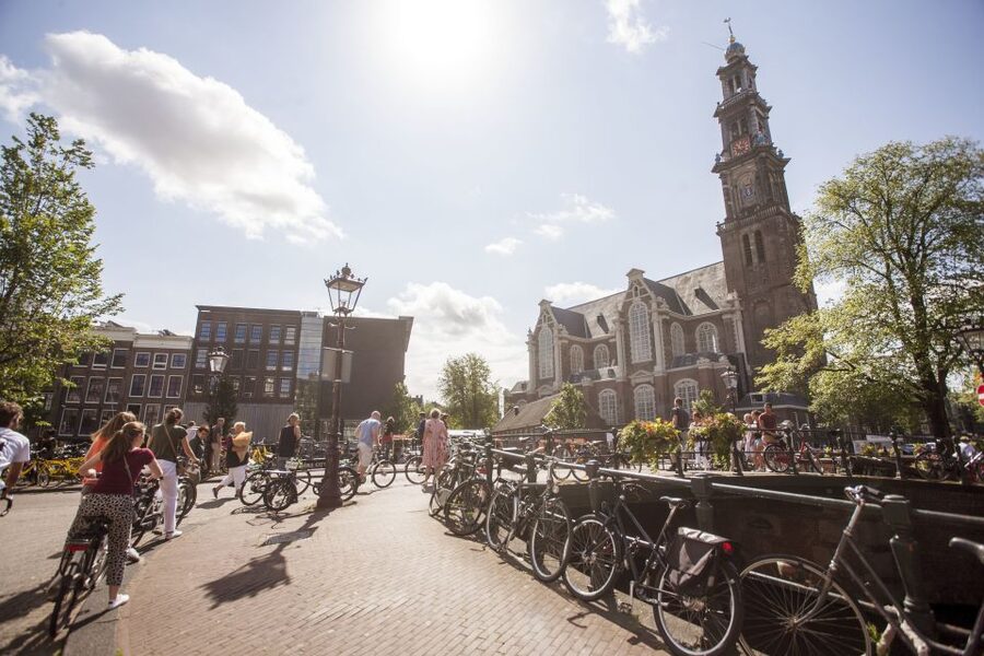 Amsterdam: Hidden Gems & Highlights Guided Bike Tour - Jordaan: canals, courtyards, and quiet lanes