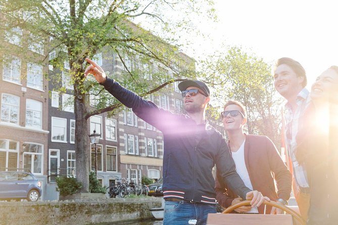Amsterdam Highlights Canal Cruise with a Drink - A classic wooden boat with a quieter feel