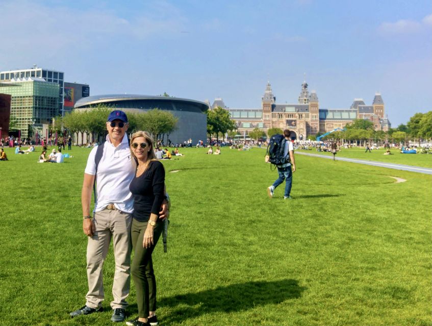 Amsterdam: Highlights & Hidden Gems Private Walking Tour - Canal banks and the floating flower market