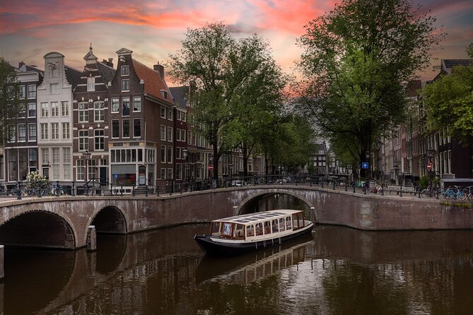 Amsterdam Historic Tour On Classic Saloon Boat - Gliding Under the Skinny Bridge