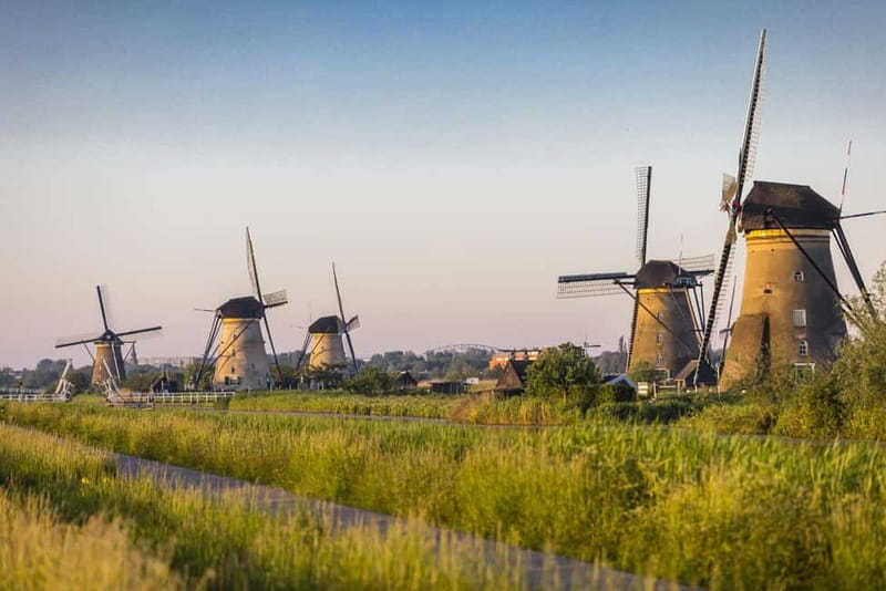 Amsterdam: Kinderdijk, Euromast, Delft and Den Haag Day Tour - A small van and a personal guide
