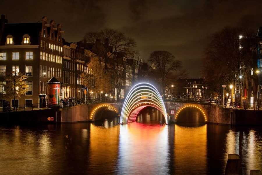 Amsterdam: Light Festival Boat Tour with Warm Drinks - Setting out on Amsterdam’s winter canals