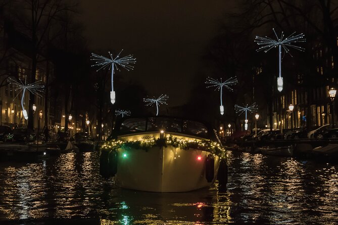 Amsterdam Light Festival: Canal Cruise + Snack & Unlimited Drinks - Inside the covered boat