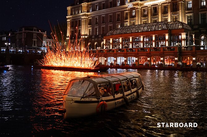Amsterdam: Light Festival Cruise with Unlimited Drinks Option - Central Station from an unusual angle