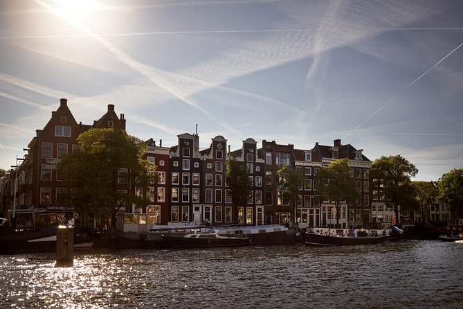 Amsterdam Light Festival: Saloon Boat Cruise + Hot Drinks & Bite - The guides and live commentary