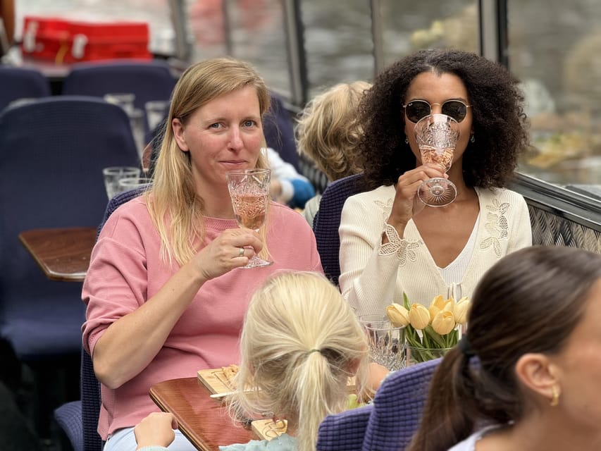 Amsterdam: Luxury Cheese & Wine Canal Cruise - Cheese, crackers, grapes, and a Dutch tasting