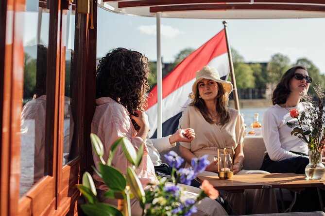 Amsterdam: Luxury Saloon Boat Cruise with Cocktails & Waffle - The route: old Amsterdam, working water, and famous bridges