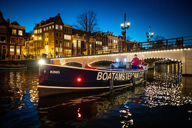 Amsterdam Open Boat Cruise in Old City Center with Live Guide - The route is about the old center, not a list of fixed stops