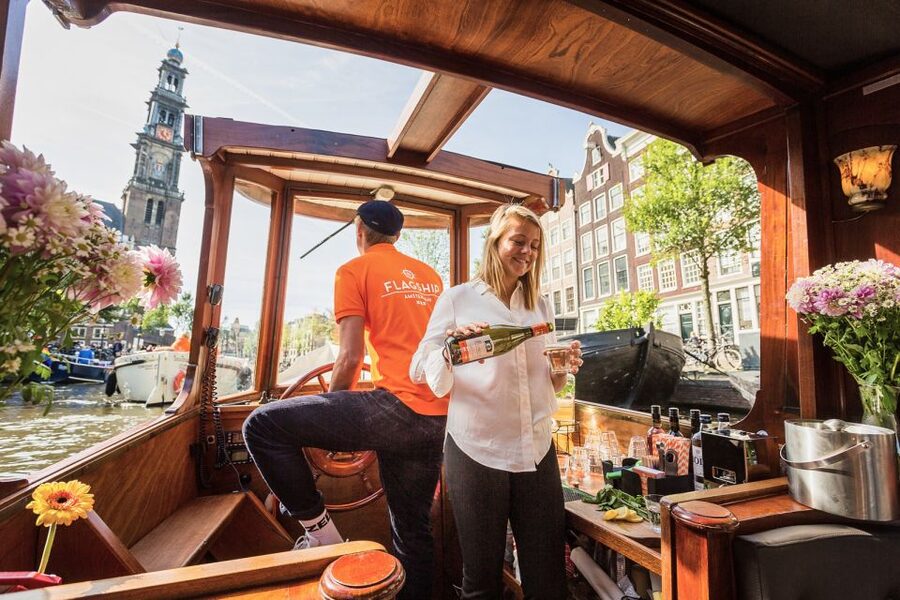 Amsterdam: Open Boat Cruise option Unlimited Drinks & Bite - The Anne Frank House area and waterside neighborhoods