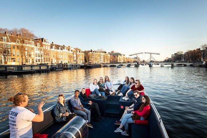 Amsterdam Open Boat Cruise with Live Guide and Two Drinks - Magere Brug and Amsterdam’s eastern waterways