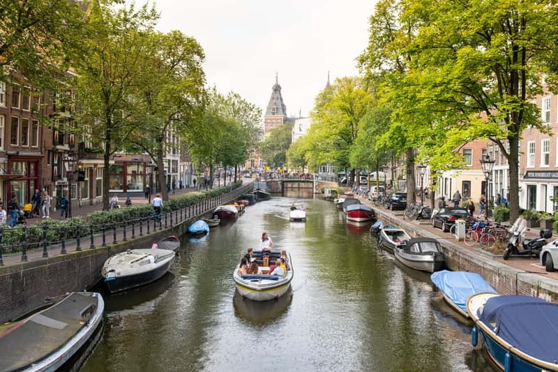 Amsterdam: Open Boat Tour of Canals with Expert Local Guide - Through Prinsengracht, where the city feels quieter