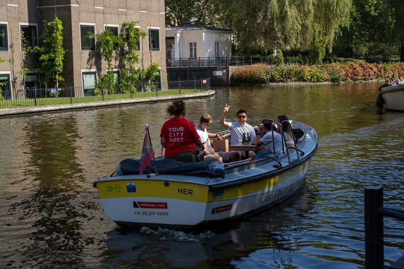 Amsterdam: Open Boat Tour of Canals with Expert Local Guide - The flower cocktail and what is not included