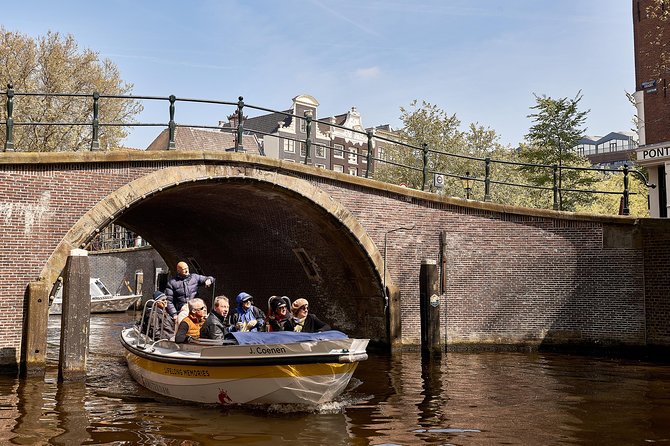 Amsterdam Open Boat Tour with Local Guide - Passing under the bridge of love