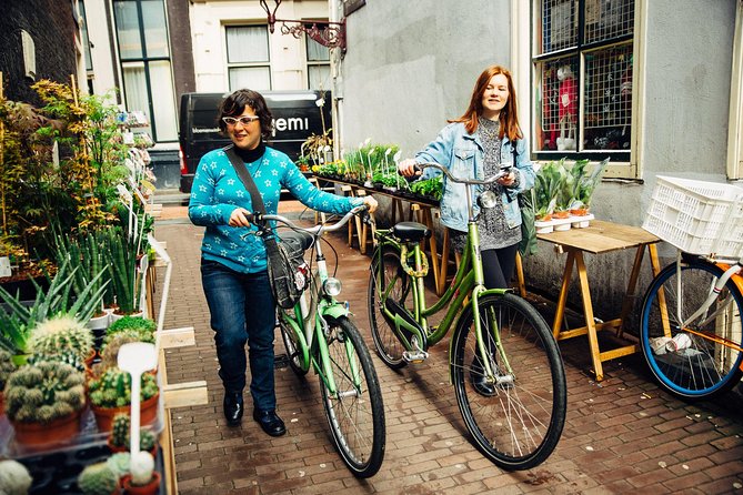 Amsterdam PRIVATE Bike Tour With Locals: Bike & Local Snack Included - The local snack or drink