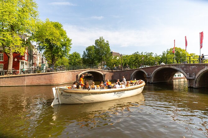 Amsterdam Private Boat Trip with Pizza and Unlimited Drinks - Canal districts, bridges, and the city’s old center