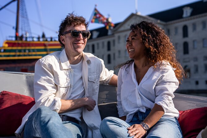 Amsterdam: Private Canal Cruise with Drinks and Snacks - The first canal views and Amsterdam’s unusual scale