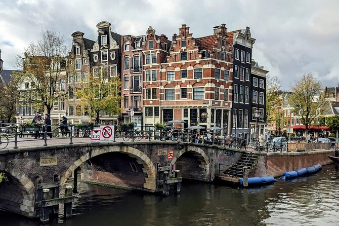 Amsterdam private city walking experience with a local - Centraal Station, a grand finish by the water