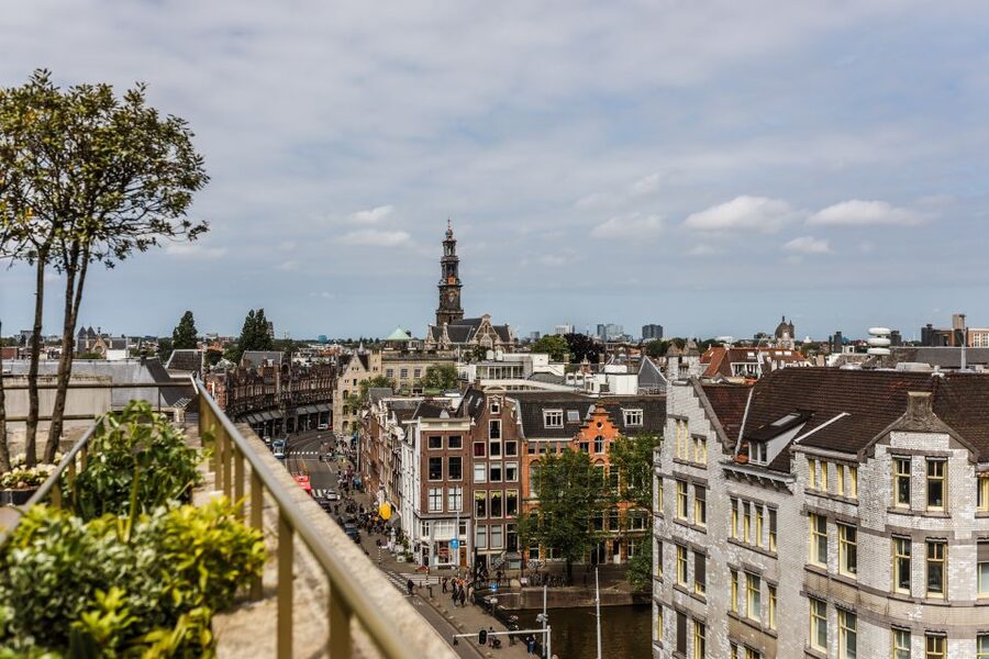 Amsterdam: Private Walking Tour of Jordaan & De 9 Straatjes - Crossing into Jordaan beside Westerkerk