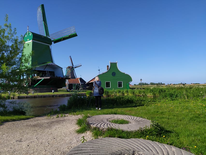 Amsterdam: Rainbow Rural Bike Tour With Local Gay Guide - Wooden houses, fields, and classic Dutch views